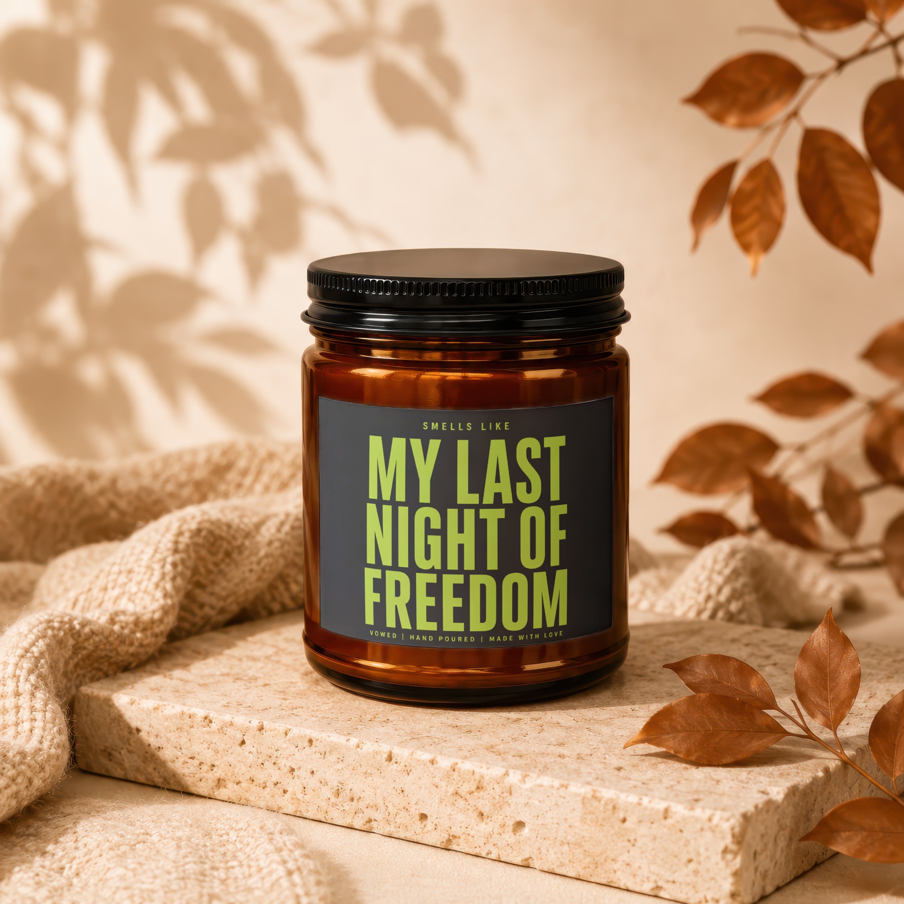 Amber candle labeled "My Last Night of Freedom" with a black lid.