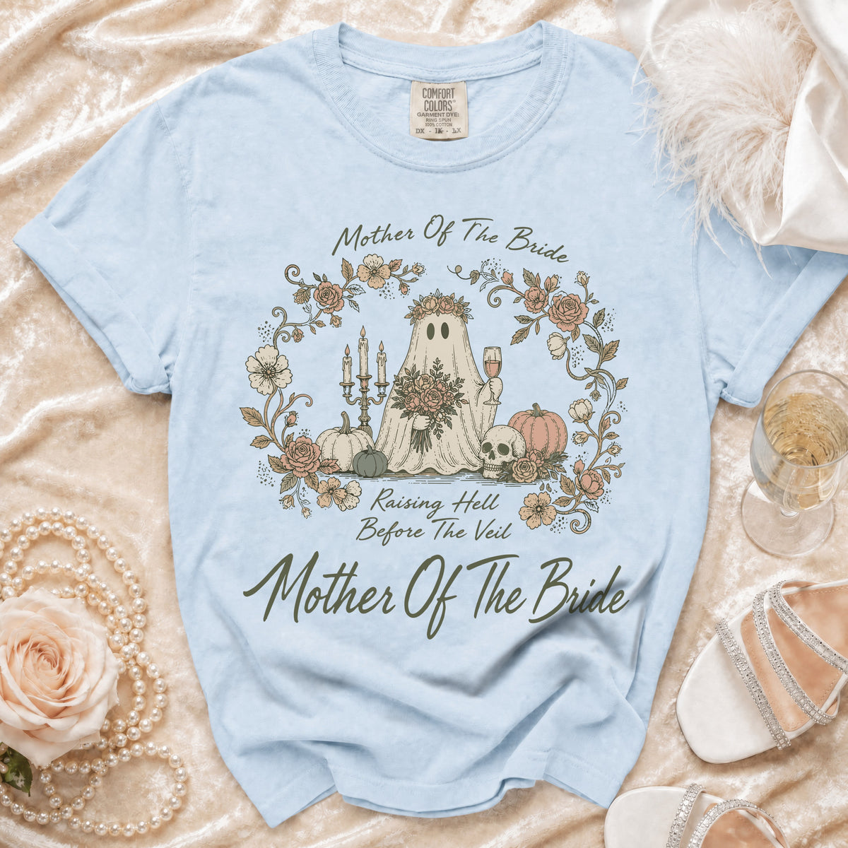 Light blue t-shirt with "Mother Of The Bride" and a ghost graphic.