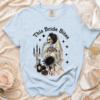 Light blue t-shirt with skeleton bride graphic and text "This Bride Bites".