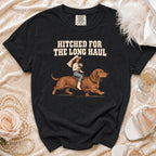 Black t-shirt with text "Hitched for the Long Haul" and illustration of bride riding a dachshund.