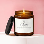 Amber jar candle with burning wick and label: "Soon, You will walk down the aisle and we will be crying in the front row."