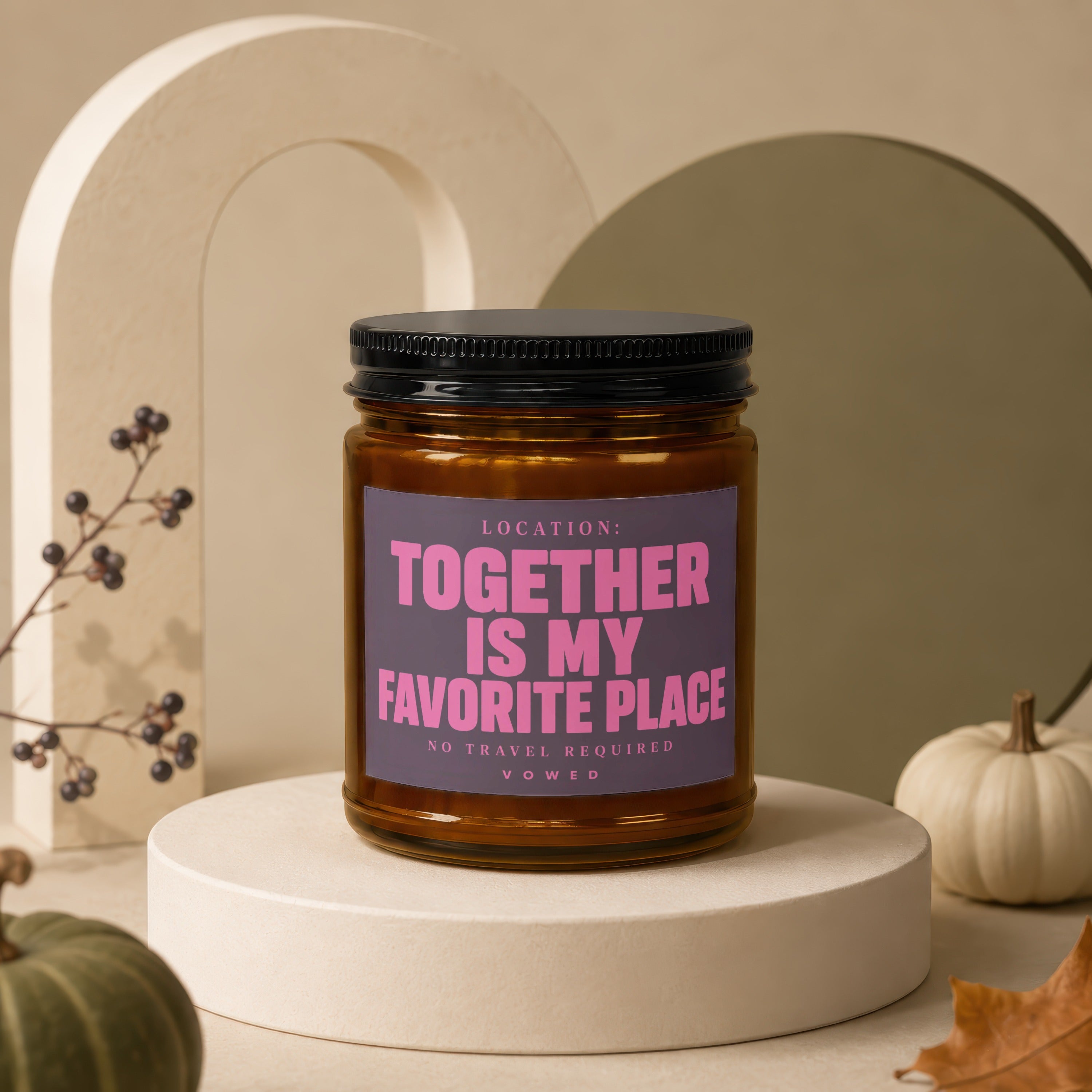 Amber jar candle with pink text reading "Together Is My Favorite Place" on a neutral background.