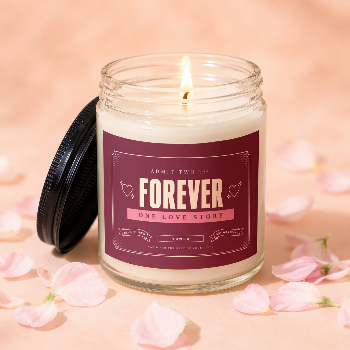 Candle with label reading "FOREVER ONE LOVE STORY", "VOWED", "HAND POURED", "SOY WAX BLEND".