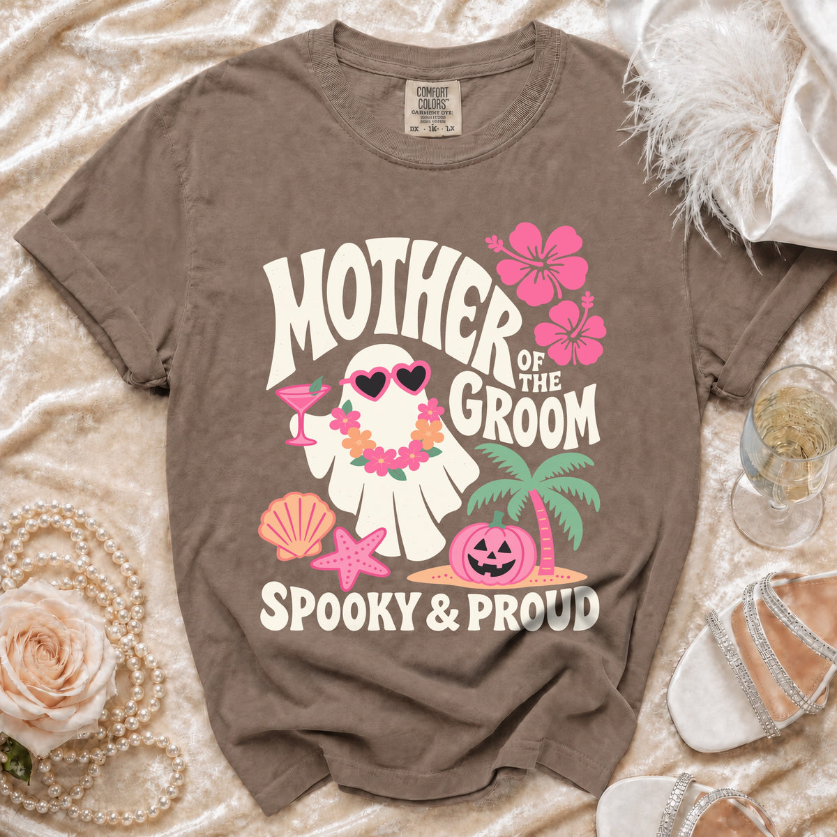 Brown t-shirt with "Mother of the Groom Spooky & Proud" text and a ghost graphic.