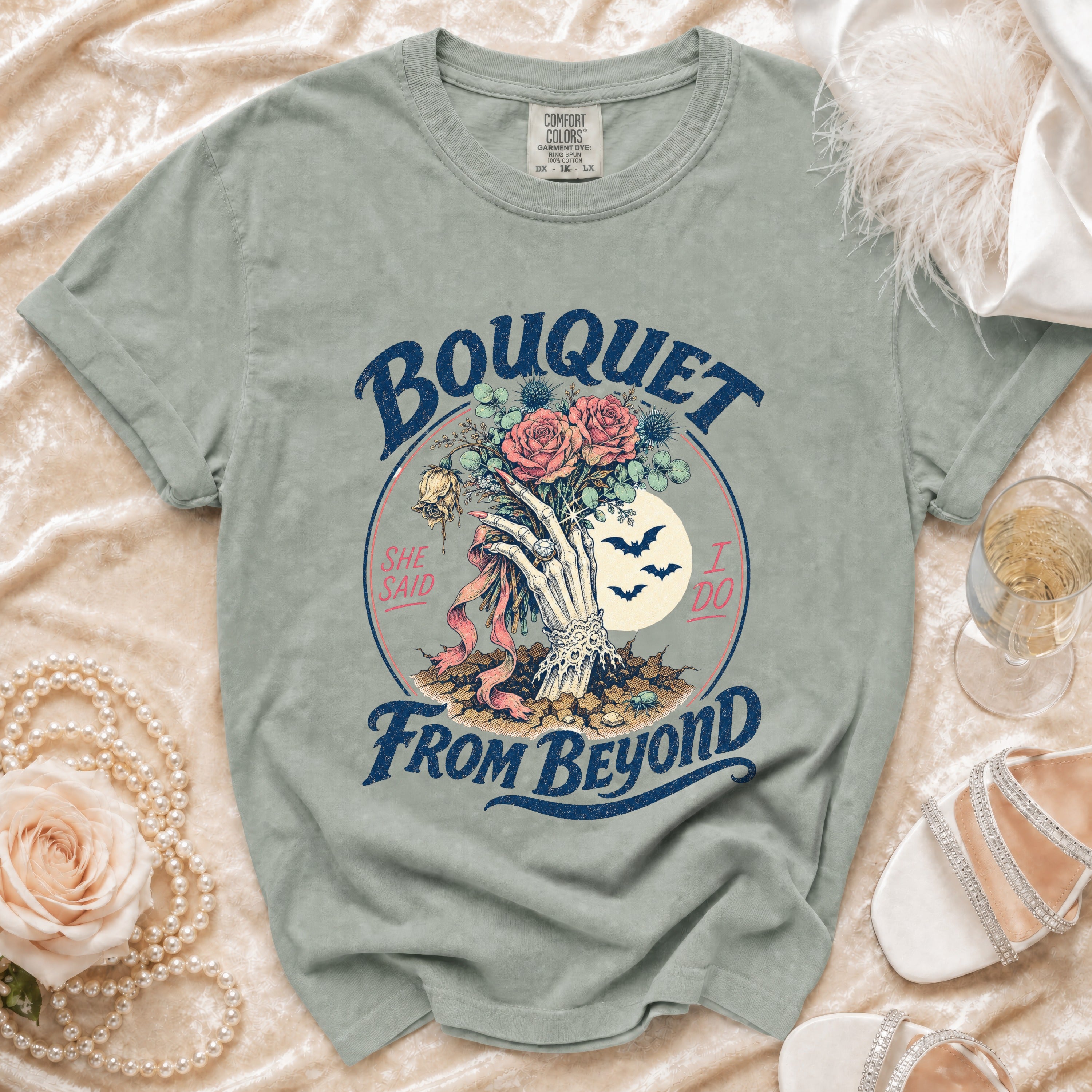 T-shirt showing skeleton hand holding bouquet with "Bouquet From Beyond" text.