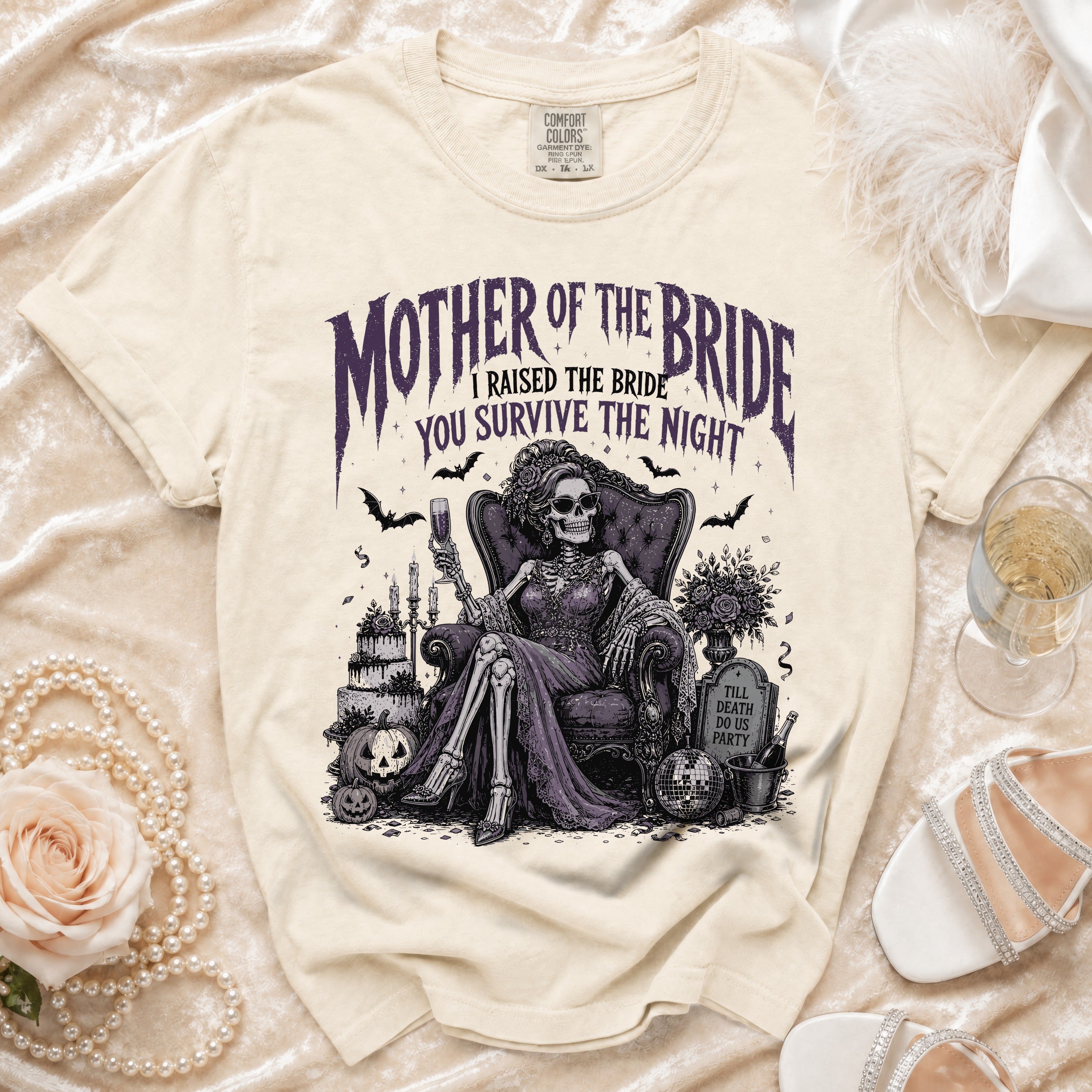 Cream t-shirt with "Mother of the Bride I Raised the Bride You Survive the Night" text and skeleton bride illustration.