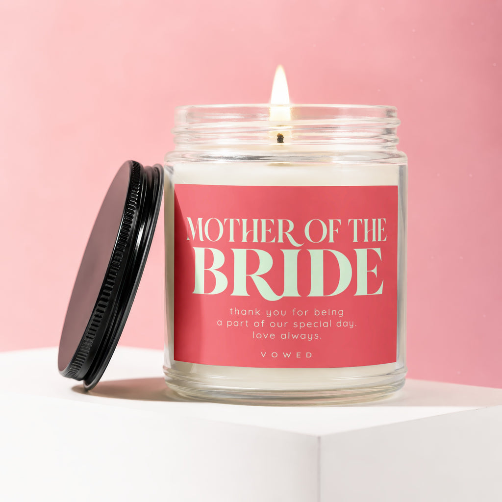 Candle with "Mother of the Bride" text and "Vowed" on a pink background.