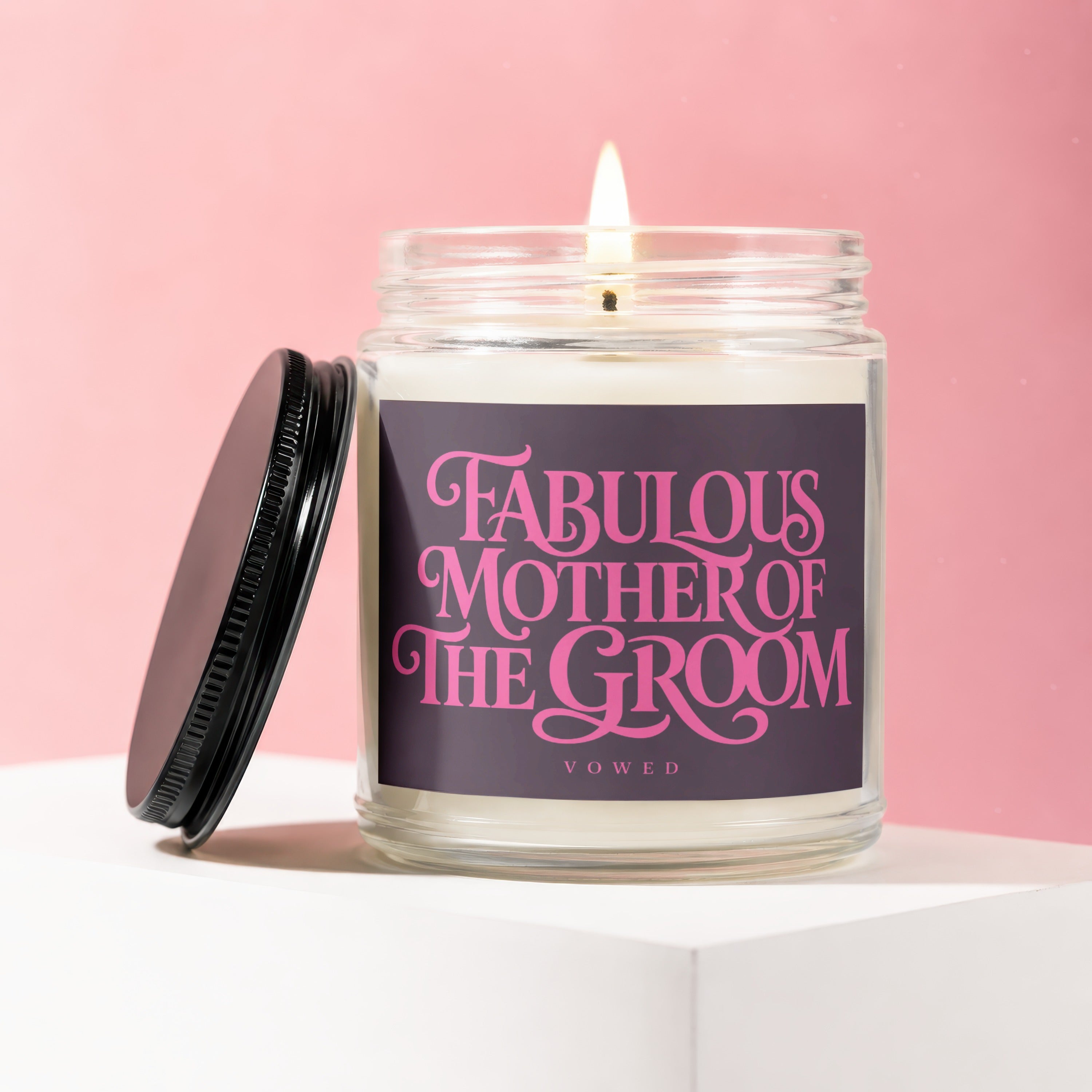 Candle with "Fabulous Mother of the Groom Vowed" text on a pink background.