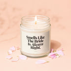 Lit candle in a jar with a label reading "Smells Like The Bride Is Always Right."