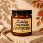 Amber candle labeled "Mission Impossible Accomplished".