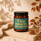 Amber candle in a brown jar with label: "Two misters, no missus"