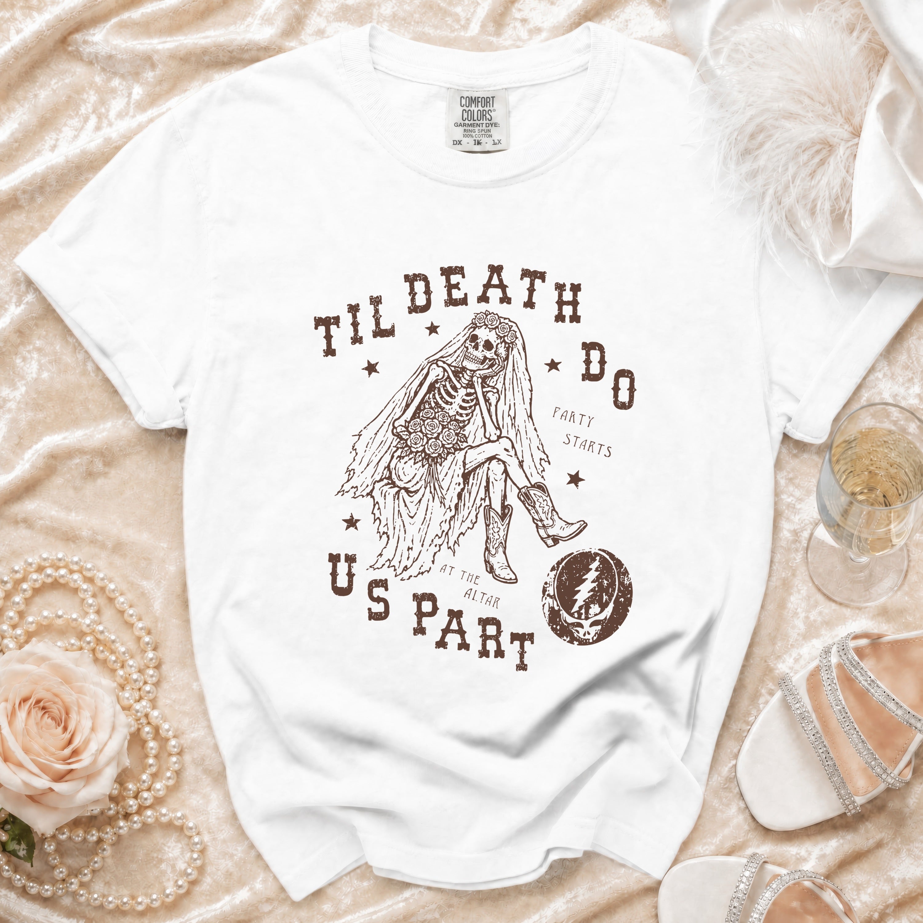 White t-shirt with skeleton bride graphic reading "Til Death Do Us Part".