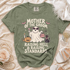 Green t-shirt with "Mother of the Groom Raising Hell & Raising Standards" text and ghost graphic.