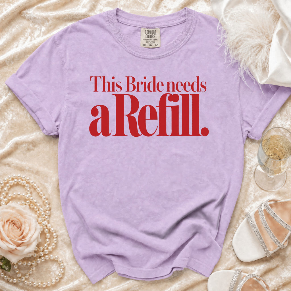 Lilac t-shirt with red text "This Bride needs a Refill."