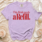 Lilac t-shirt with red text "This Bride needs a Refill."