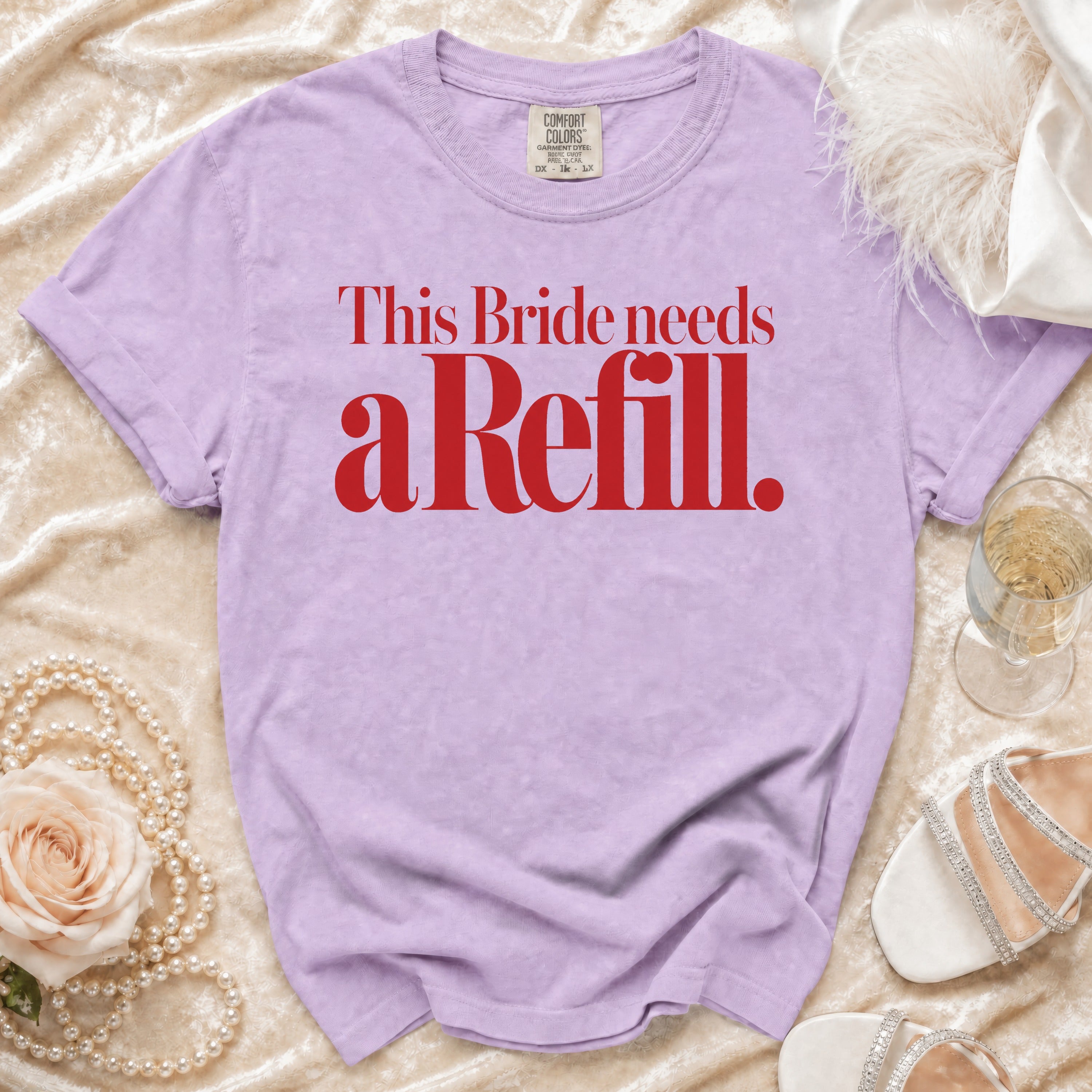 Lilac t-shirt with red text "This Bride needs a Refill."
