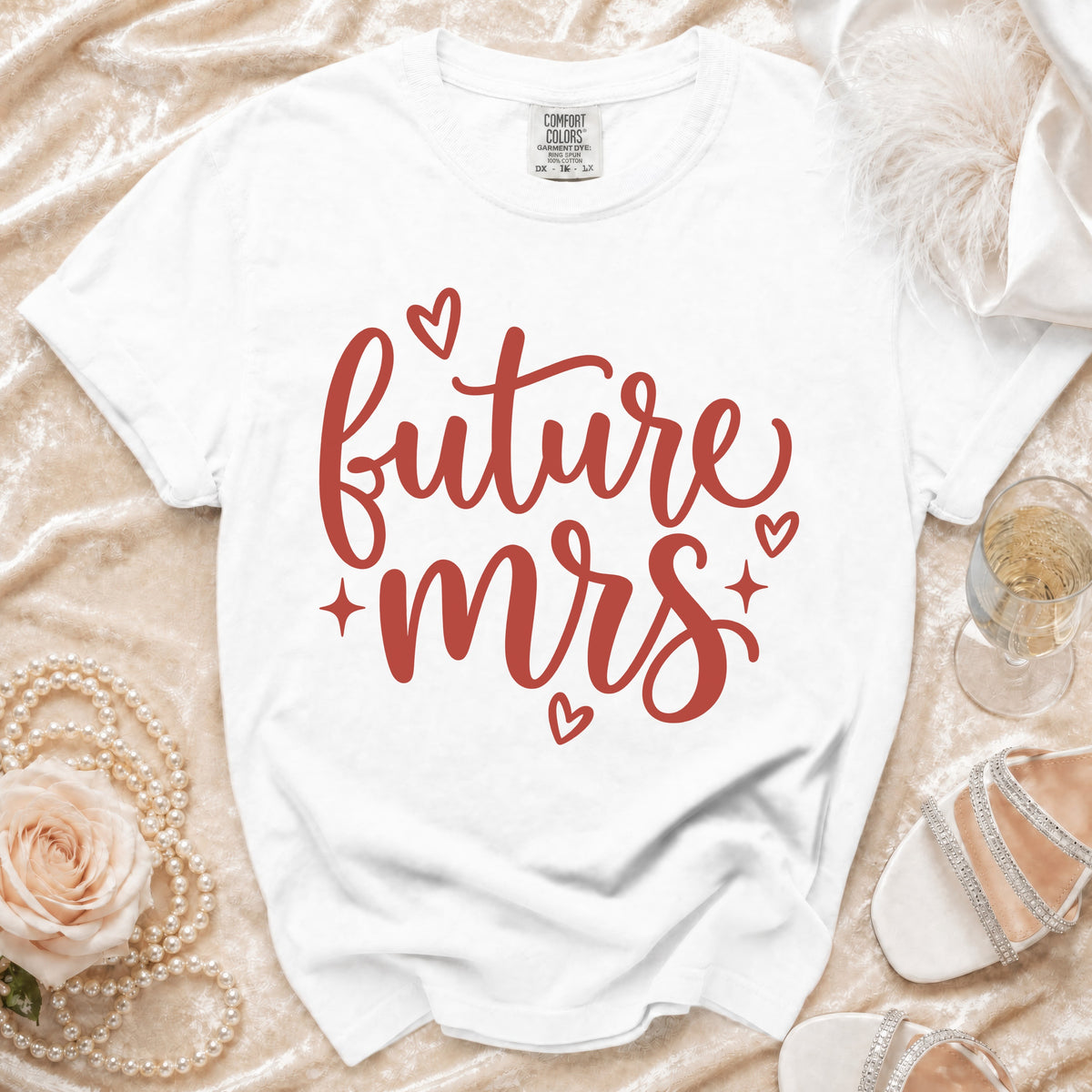 White t-shirt with red text "future mrs" and small hearts.