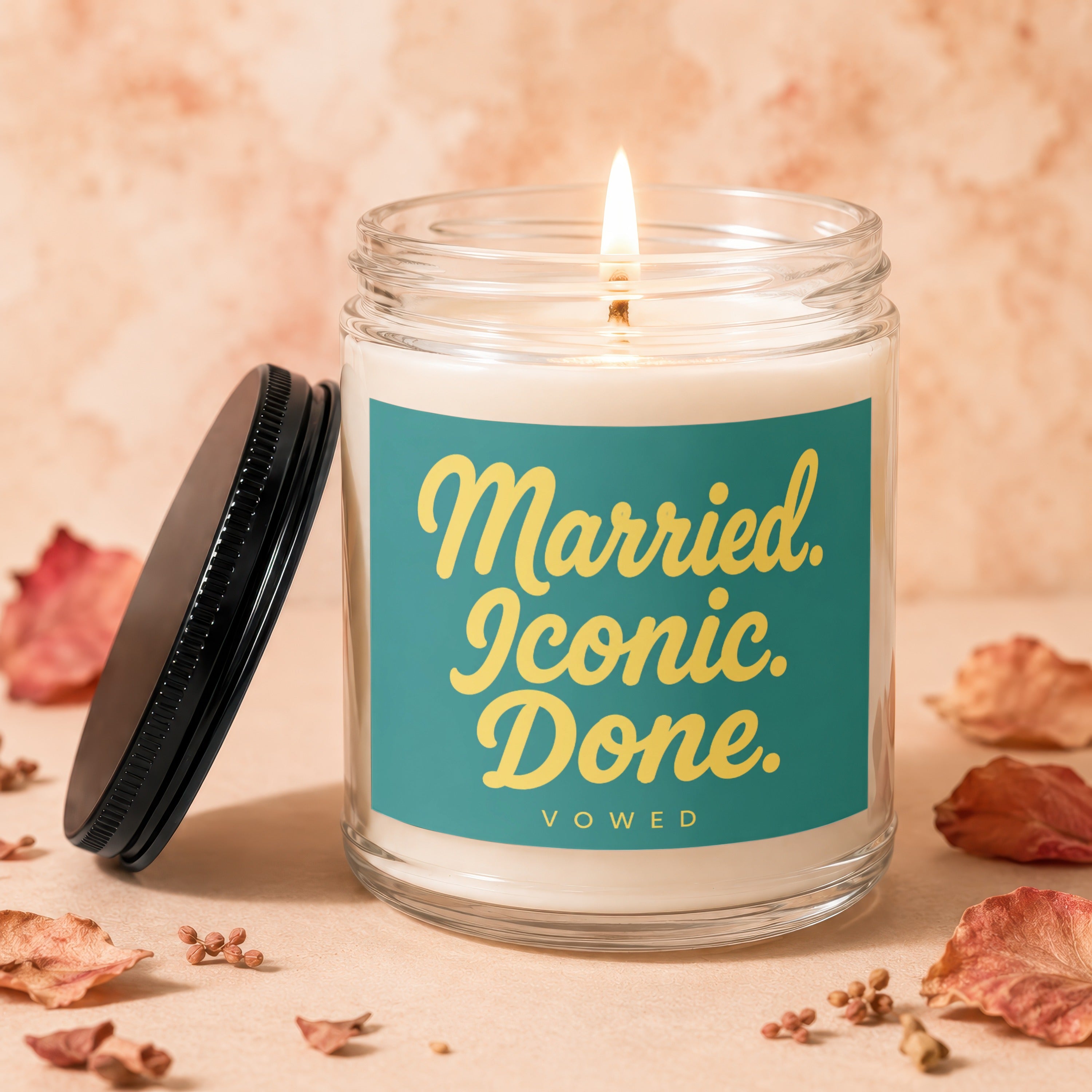Lit candle in a glass jar with lid asking "Married. Iconic. Done. VOWED."