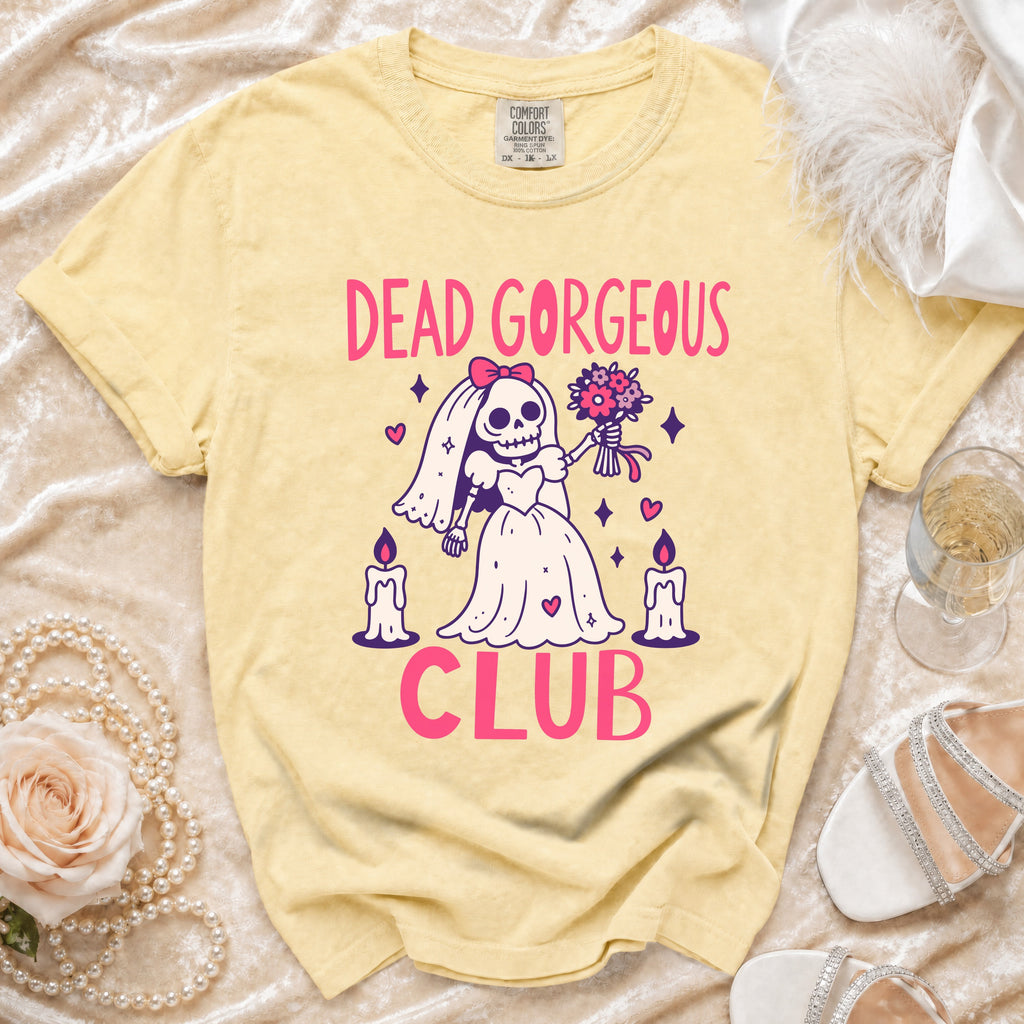 Yellow t-shirt with "DEAD GORGEOUS CLUB" text and skeleton bride graphic.