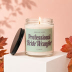 Lit candle in jar with "Smells Like Professional Bride Wrangler" label and "Vowed"