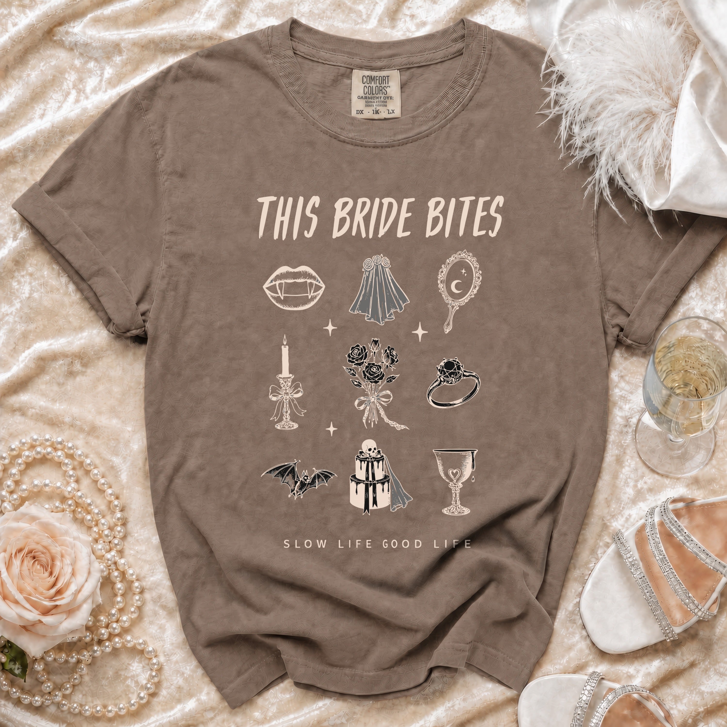 Brown t-shirt with "This Bride Bites" and gothic wedding icons.