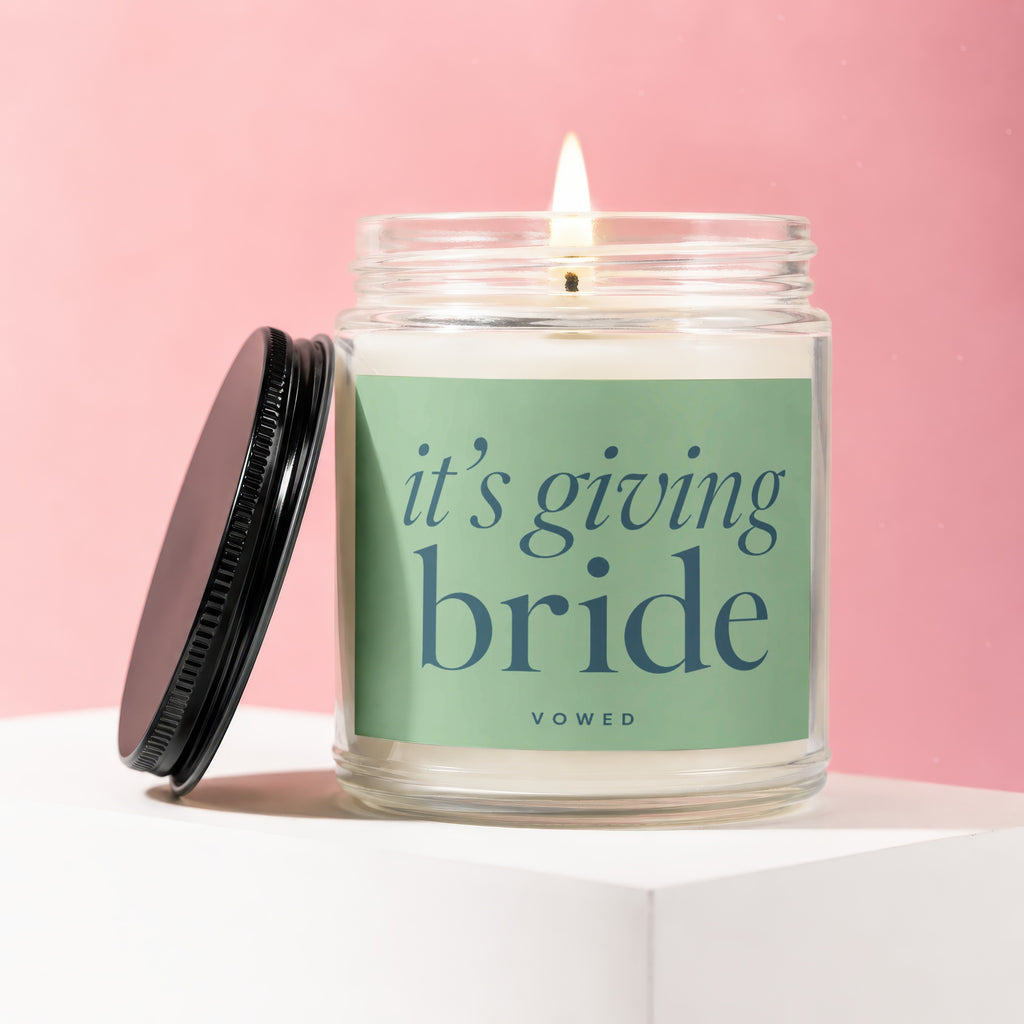 Candle with "it's giving bride" text on a green label.