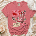 Pink graphic t-shirt with "Her Last Rodeo" text, cowboy boot, and butterflies.