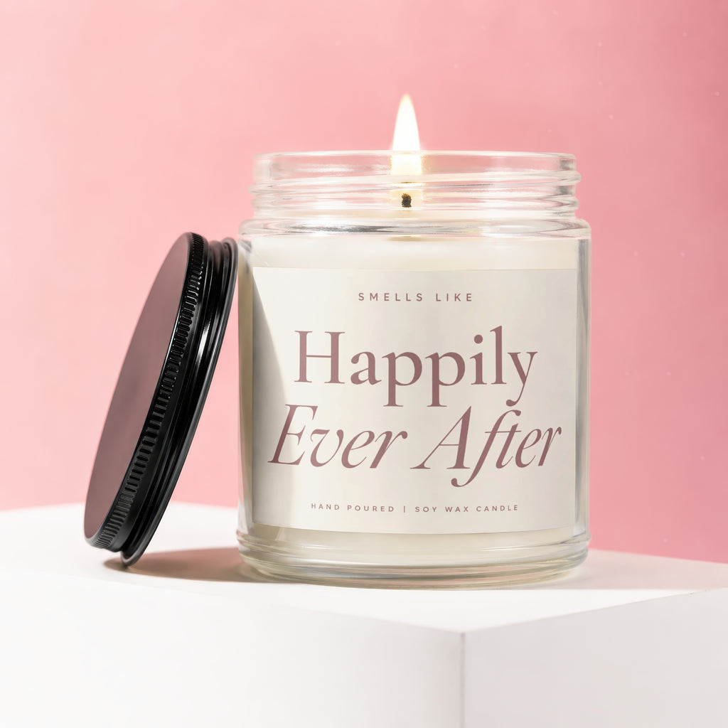 Hand-poured soy wax candle in a jar with a lid, labeled "Happily Ever After."