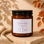 Amber jar candle with label text "From someday 'Yes' to 'I Do' VOWED".