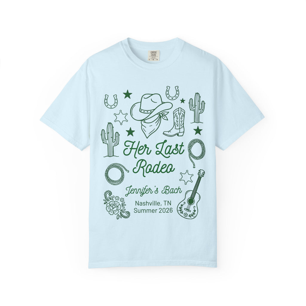 Light blue t-shirt with "Her Last Rodeo" text and Western motifs.