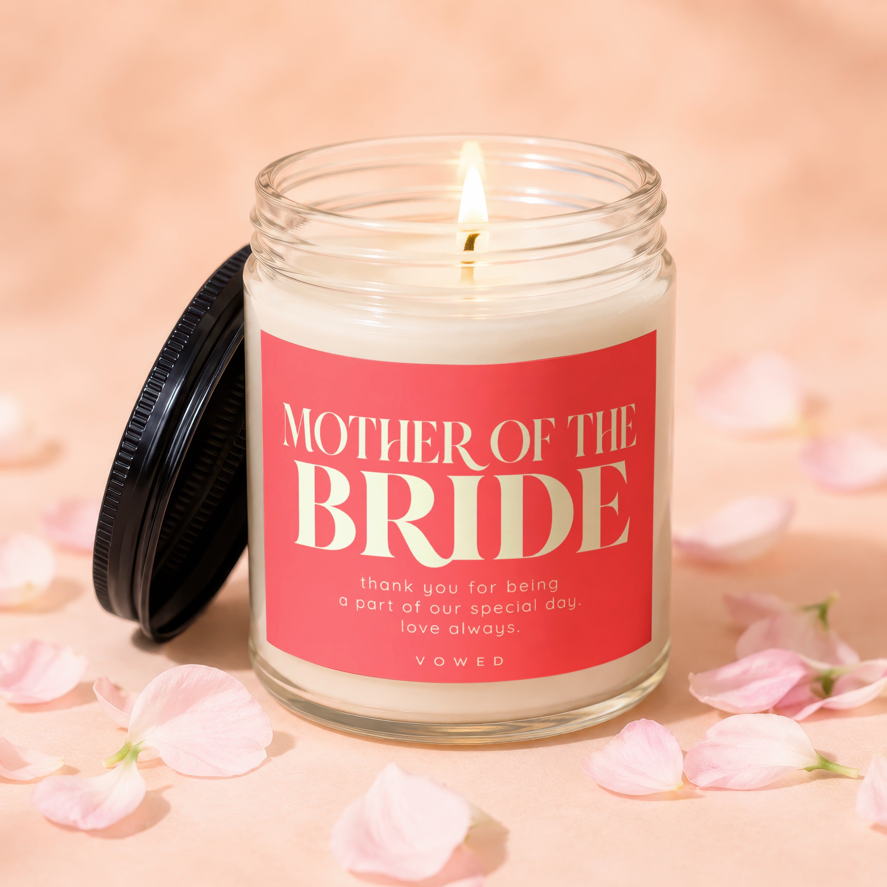 Candle labeled "Mother of the Bride" with sentiment text on pink background.