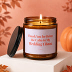 Amber jar candle with lit flame, reads "Thank You for Being the Calm in My Wedding Chaos."