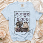 Light blue t-shirt with "Mother of the Bride" graphic featuring ghosts and Halloween motifs.