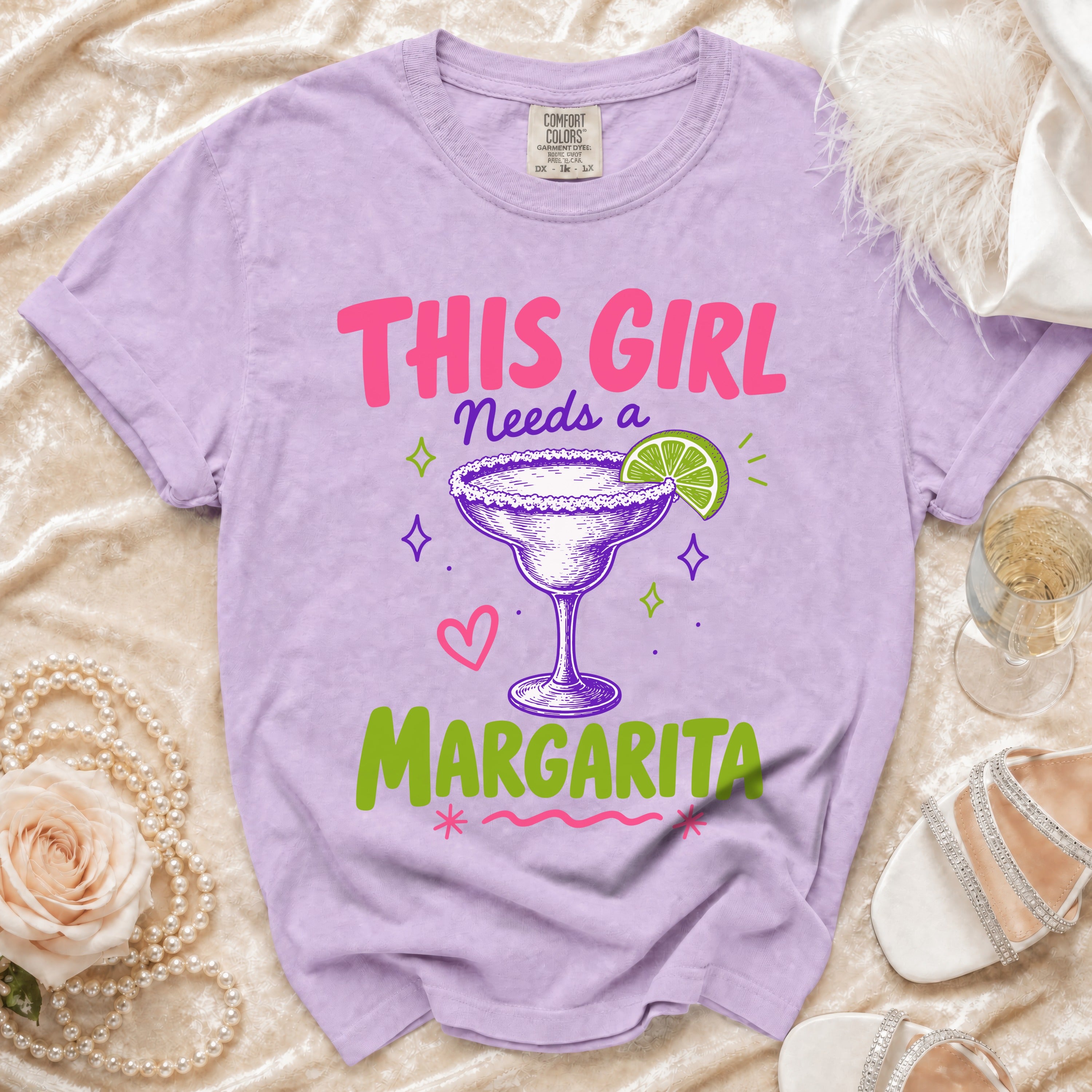 Purple t-shirt with "THIS GIRL NEEDS A MARGARITA" text and margarita graphic.