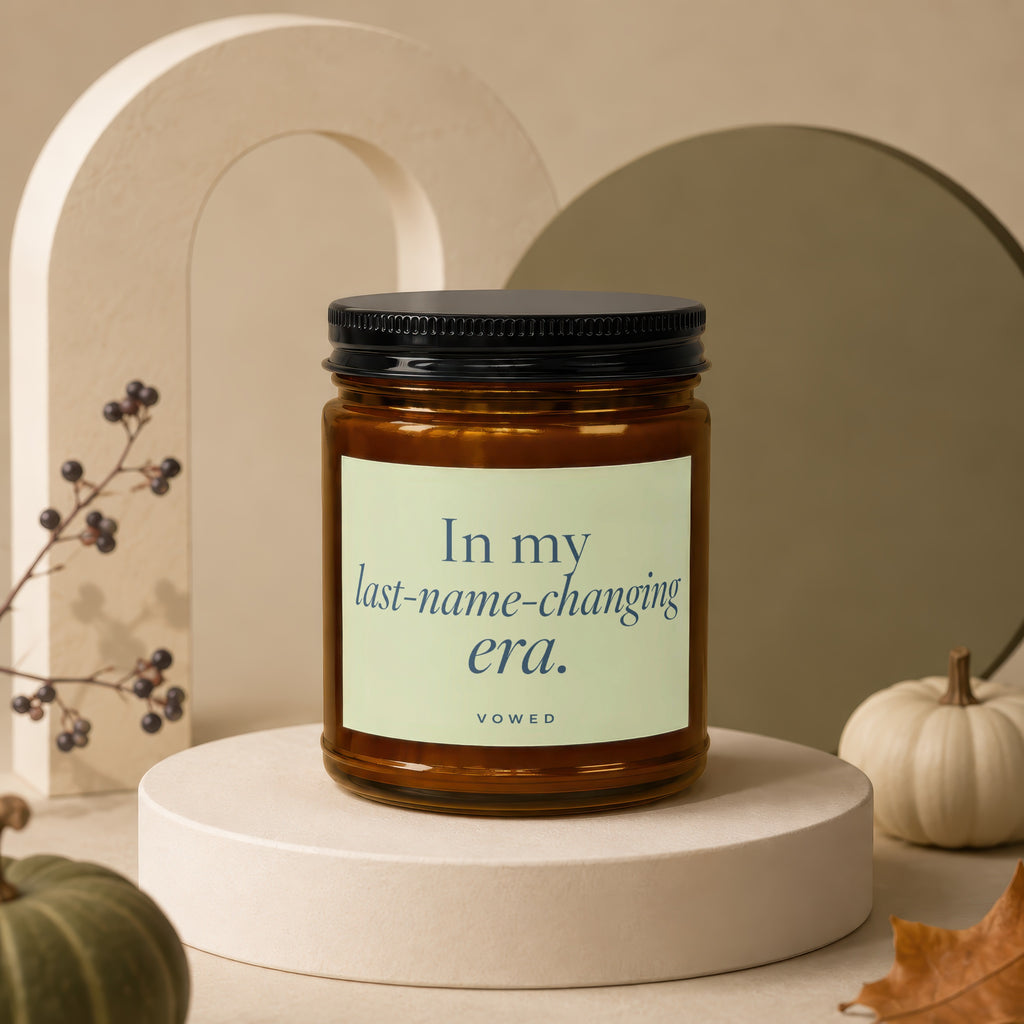 Amber jar candle with "In my last-name-changing era." text, VOWED.