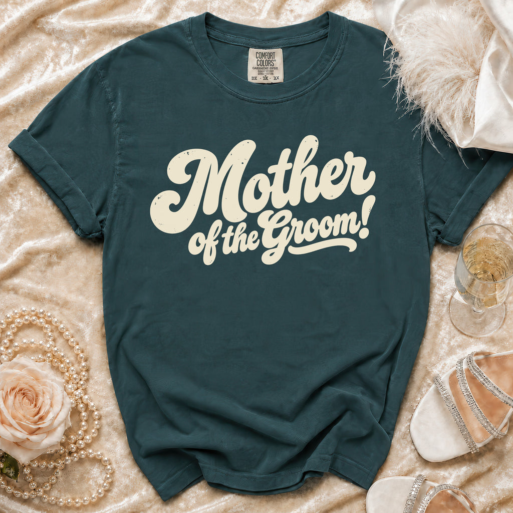 Teal t-shirt with "Mother of the Groom!" in cream retro text.