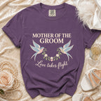 Purple t-shirt with "Mother of the Groom" and "Love takes flight" text.
