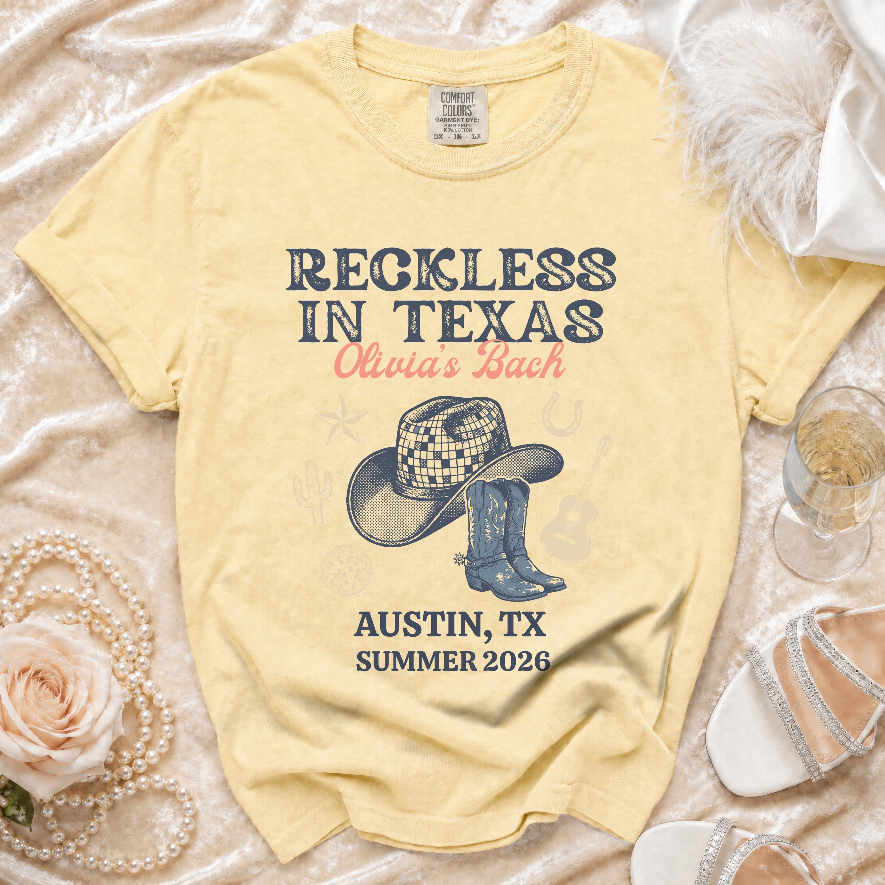 Yellow t-shirt with "Reckless in Texas Olivia's Bach" and Austin, TX Summer 2026.