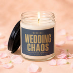 Lit candle with a dark label that reads "WARNING: WEDDING CHAOS Proceed with Champagne."