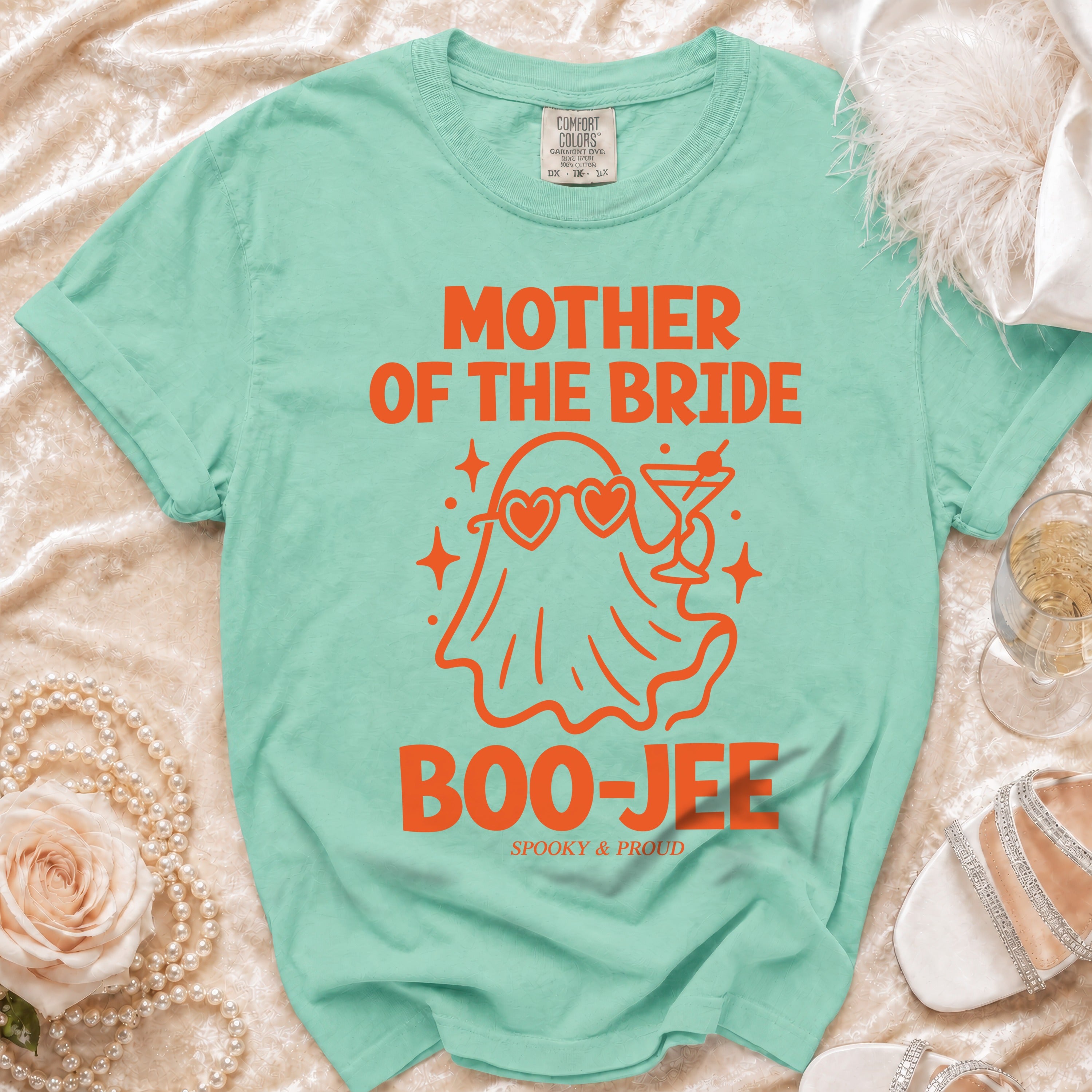 Mint green t-shirt with "MOTHER OF THE BRIDE BOO-JEE SPOOKY & PROUD" in orange.