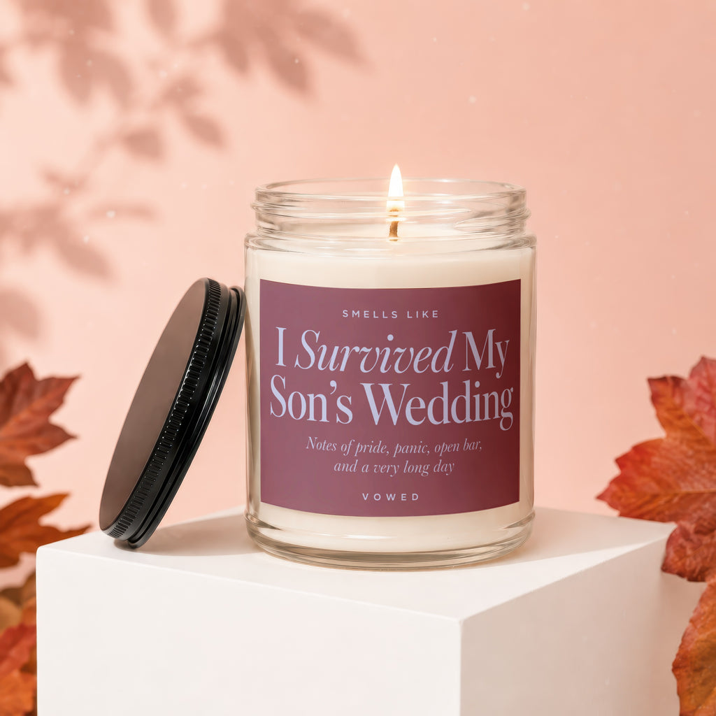 Candle that says "I Survived My Son's Wedding" and "VOWED"