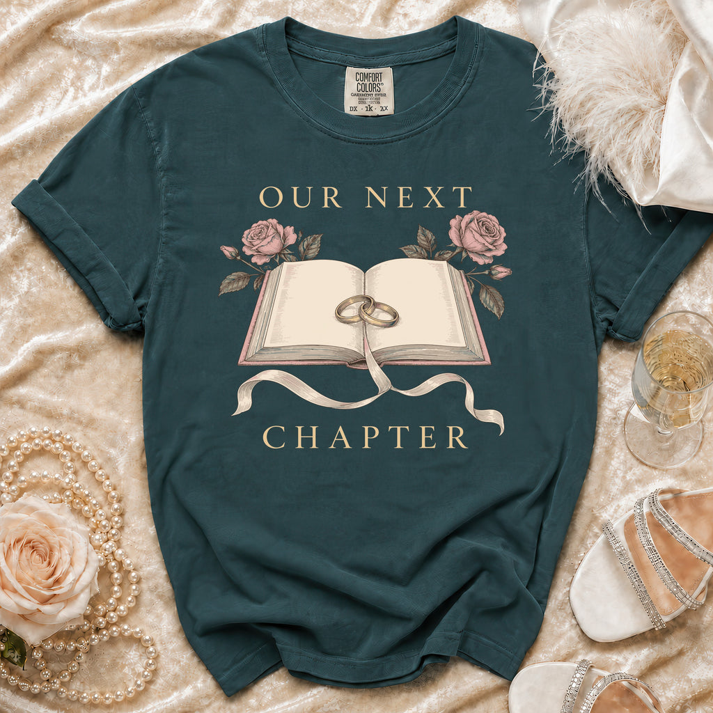 Teal t-shirt with "Our Next Chapter" text, an open book, rings, and roses.