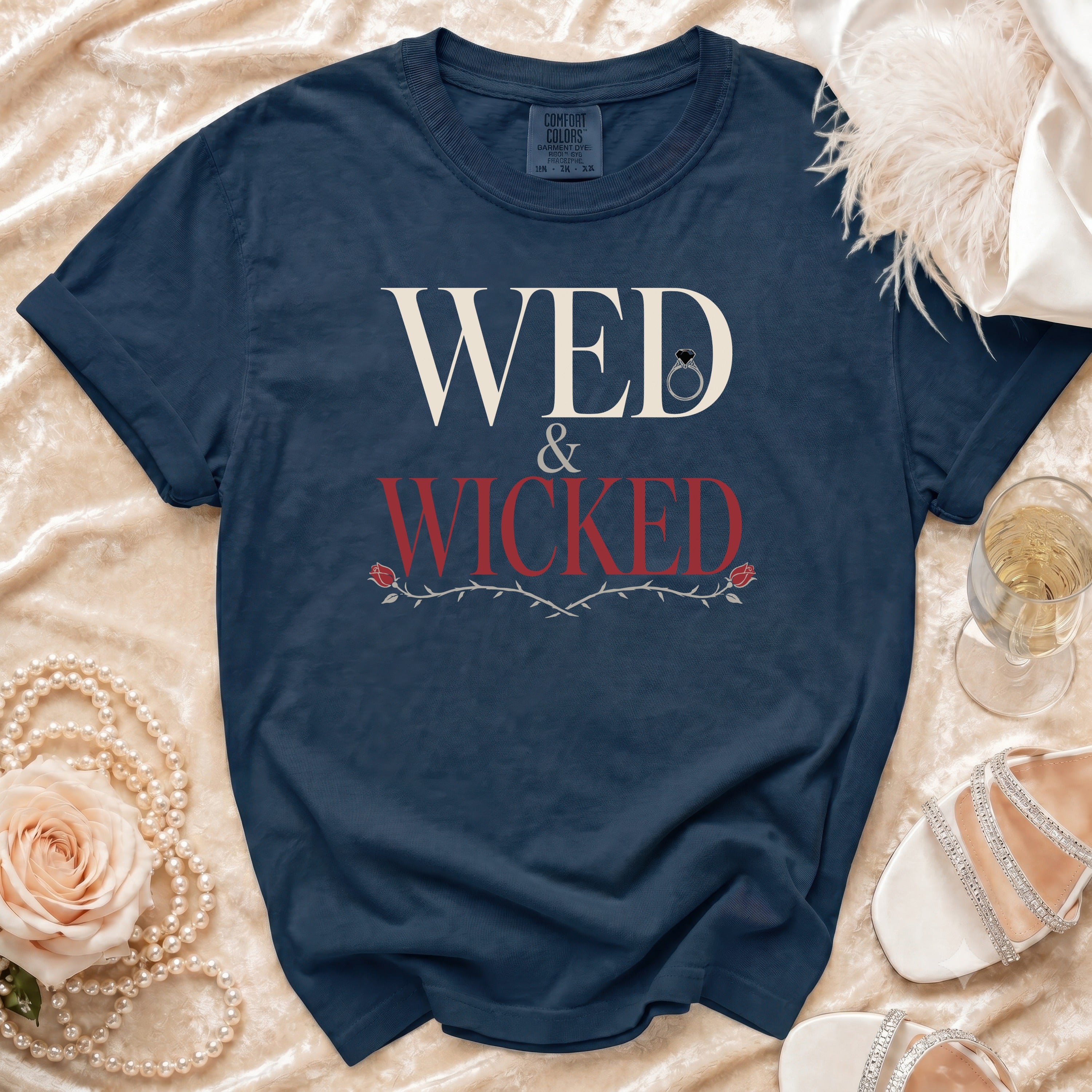 Navy Comfort Colors t-shirt with "WED & WICKED" text, wedding ring, and rose vine graphic.