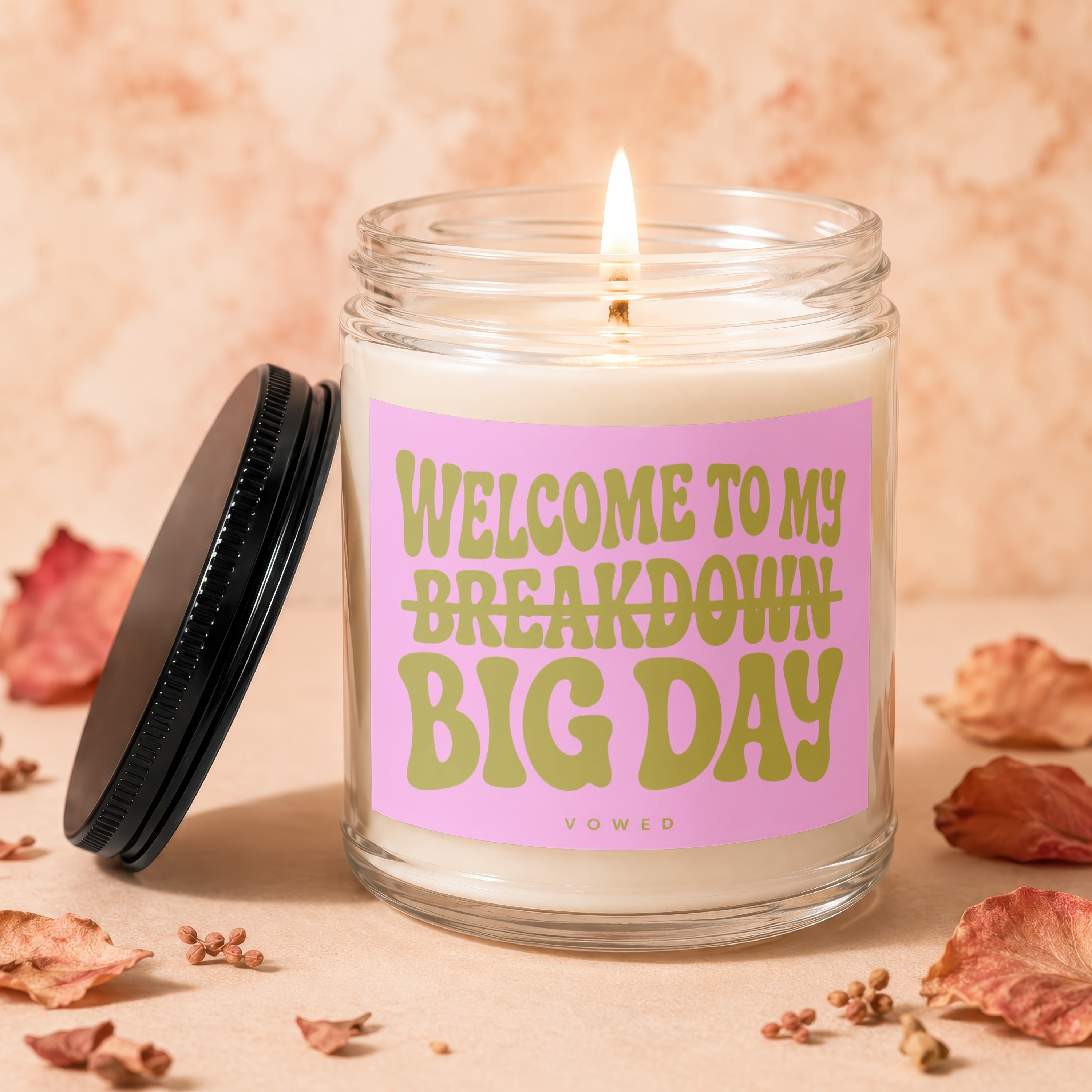 Glass jar candle with pink label reading "Welcome to My Breakdown Big Day"