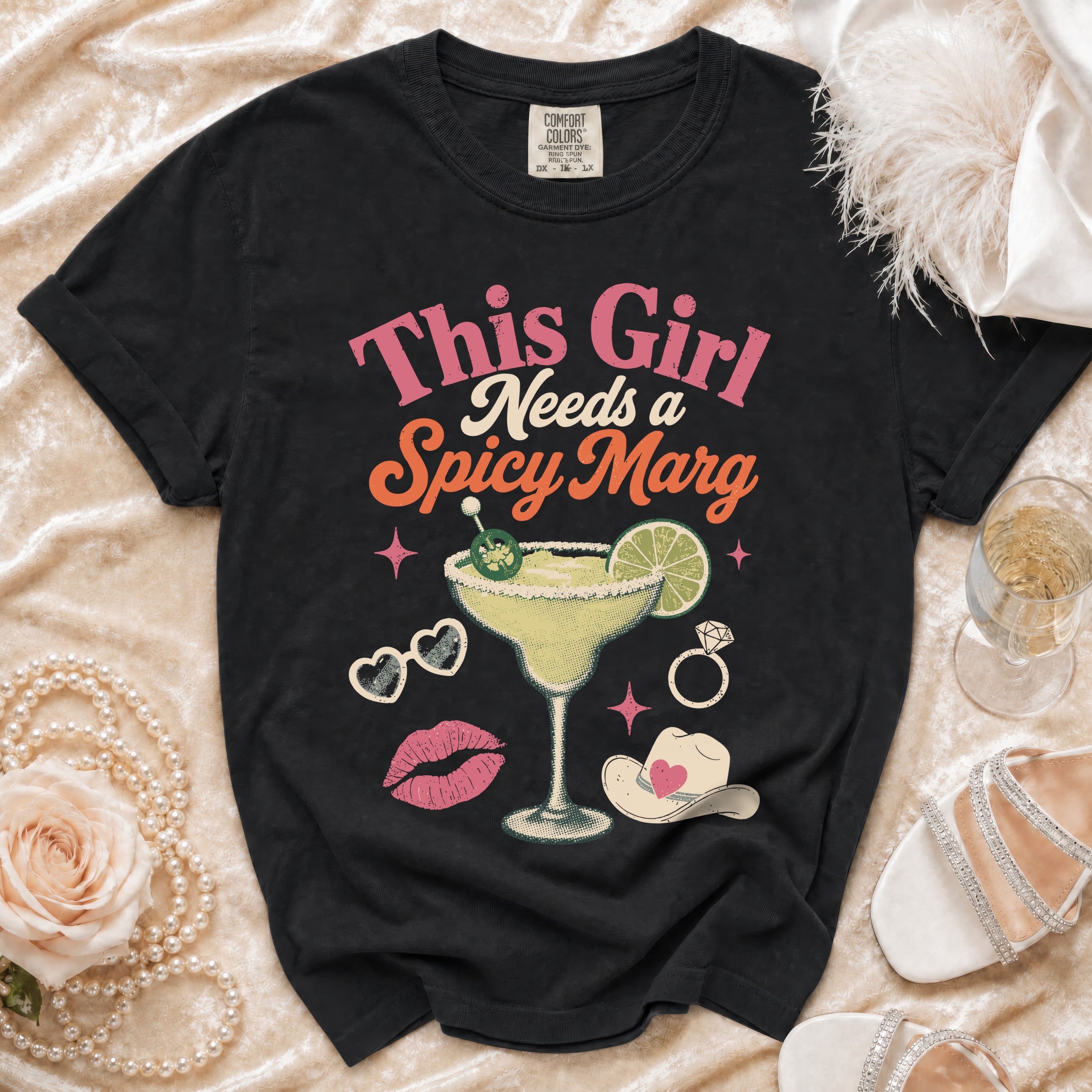 Black t-shirt with "This Girl Needs a Spicy Marg" graphic and margarita.