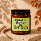 Glass candle with a lime green label reading "Maid of Honor on Off Duty."