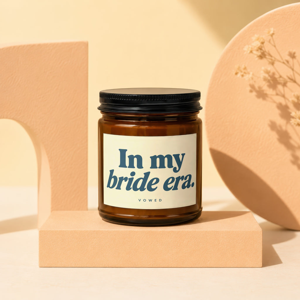 Amber jar candle with "In my bride era." text on the label.