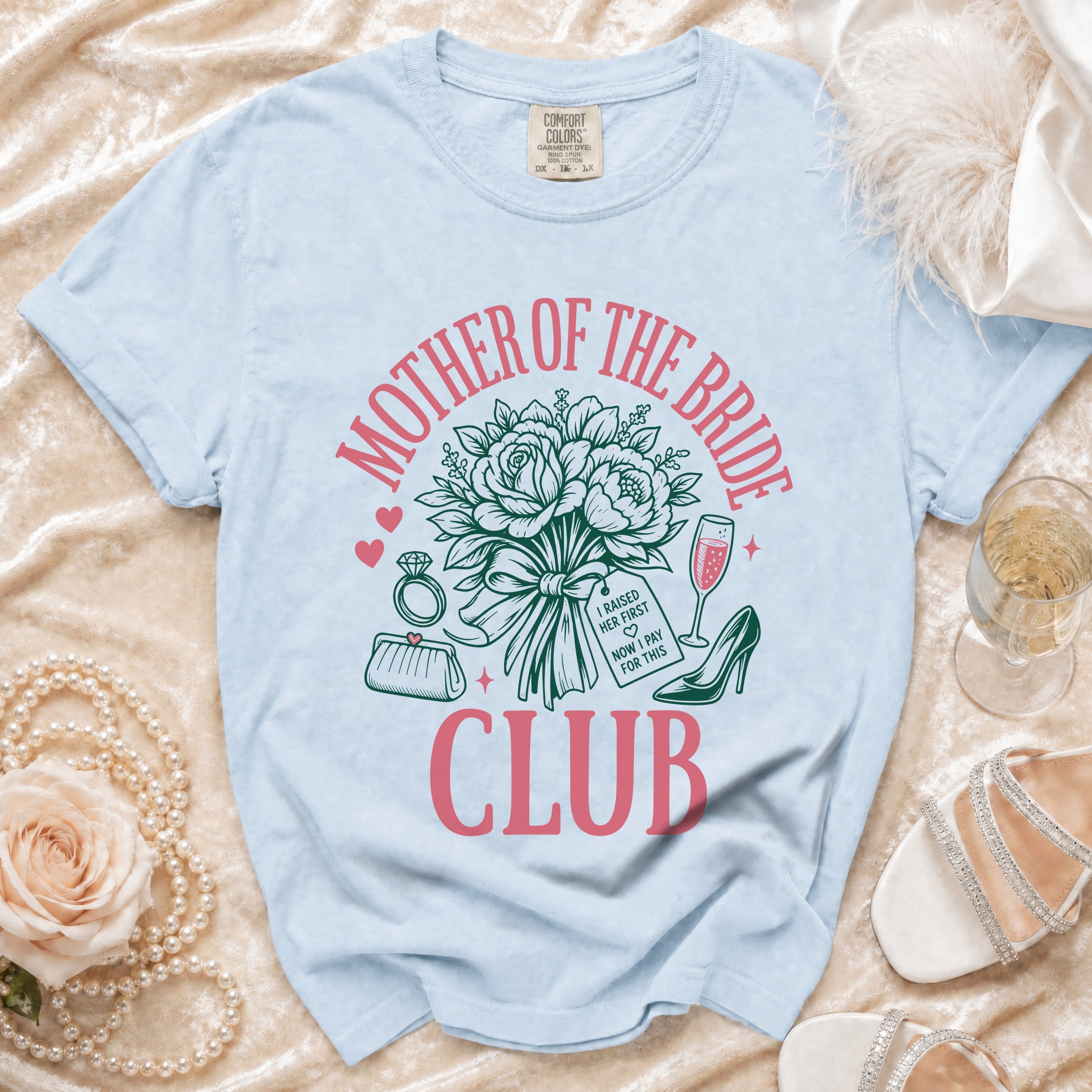 Light blue t-shirt with "Mother of the Bride Club" text and wedding graphics.