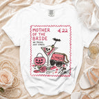 White t-shirt with "Mother of the Bride" design and price tag.