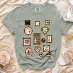 Light green t-shirt with gold-framed Halloween-themed artwork including a ghost bride and spooky phrases.